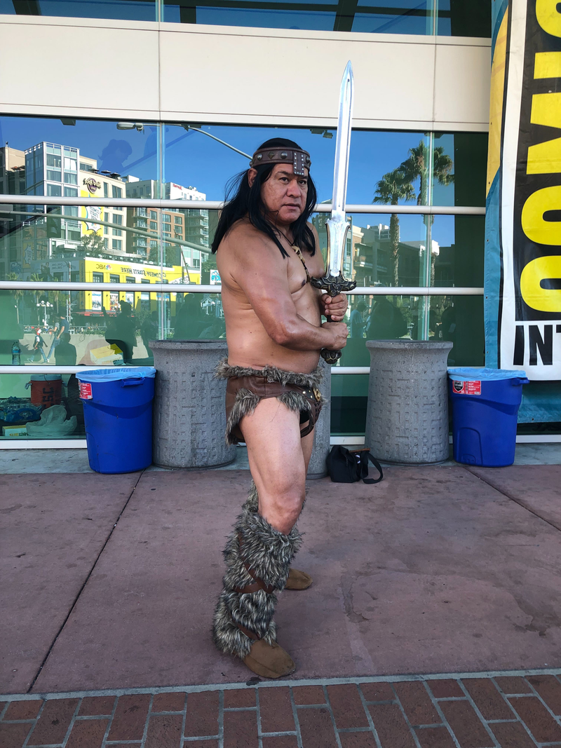 Conan readies his sword.